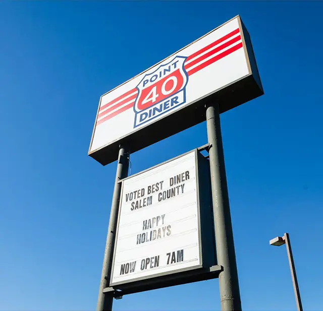 A sign for route 4 0 diner in the sky