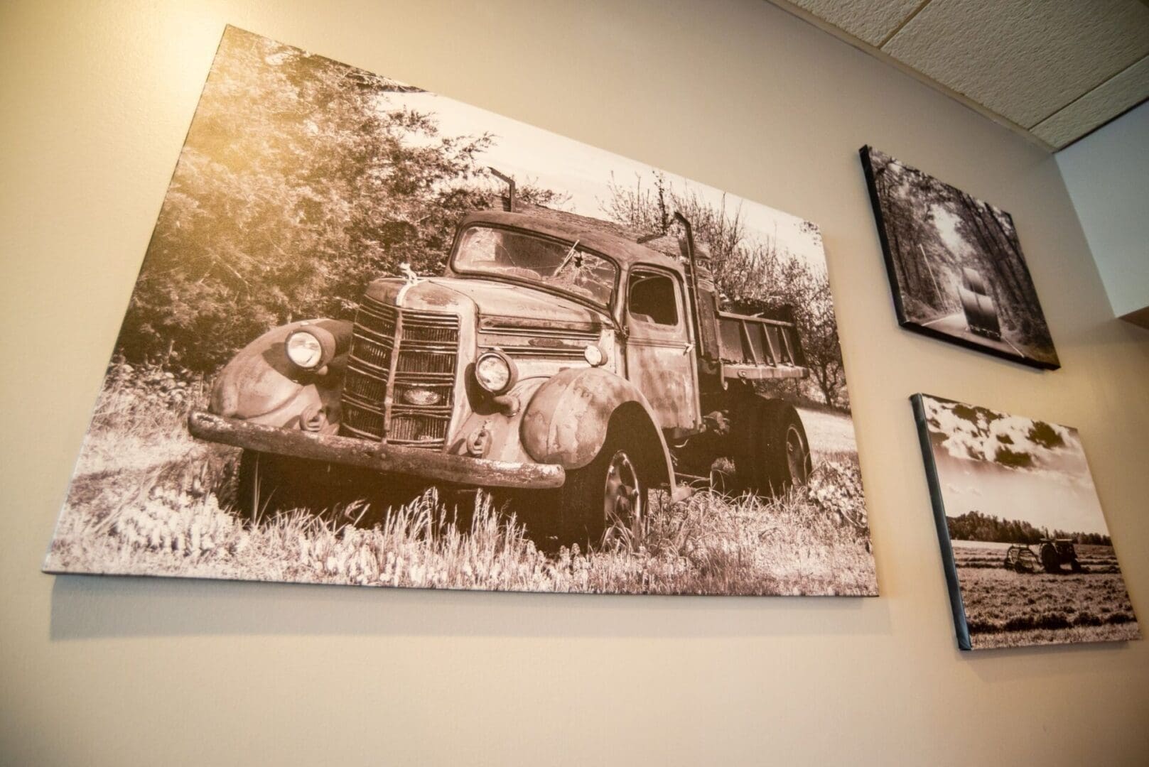 A large picture of an old truck on the wall.