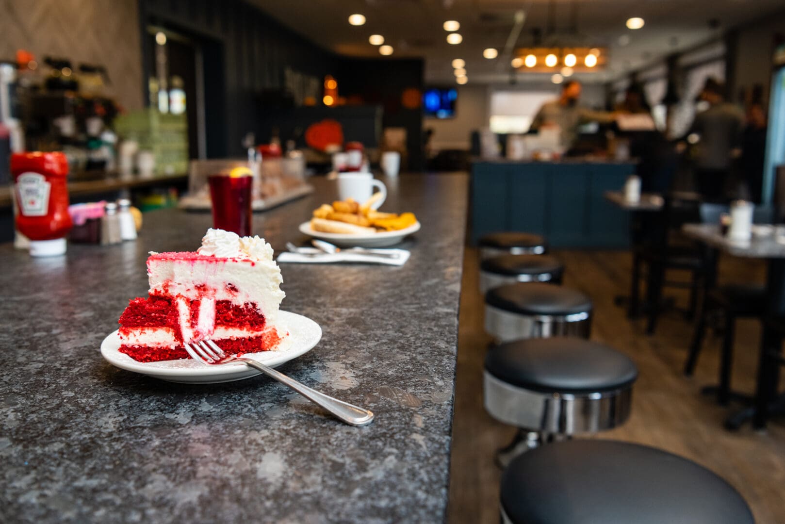 A plate with cake kept on a counter