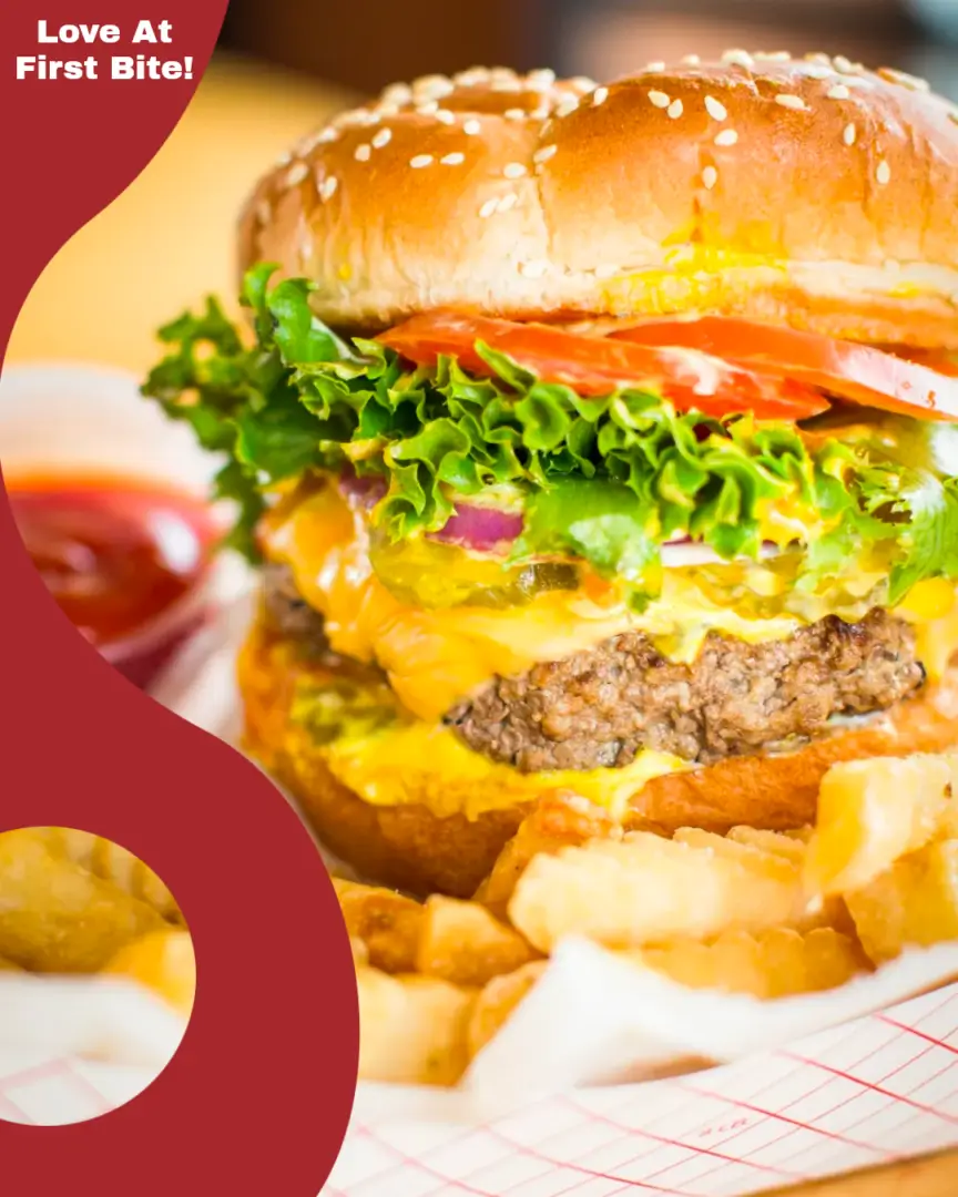 A hamburger and fries with ketchup on the side.