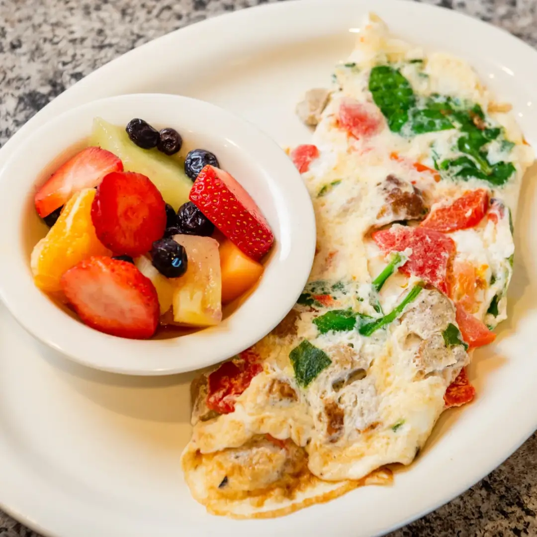 A plate of food with fruit on it